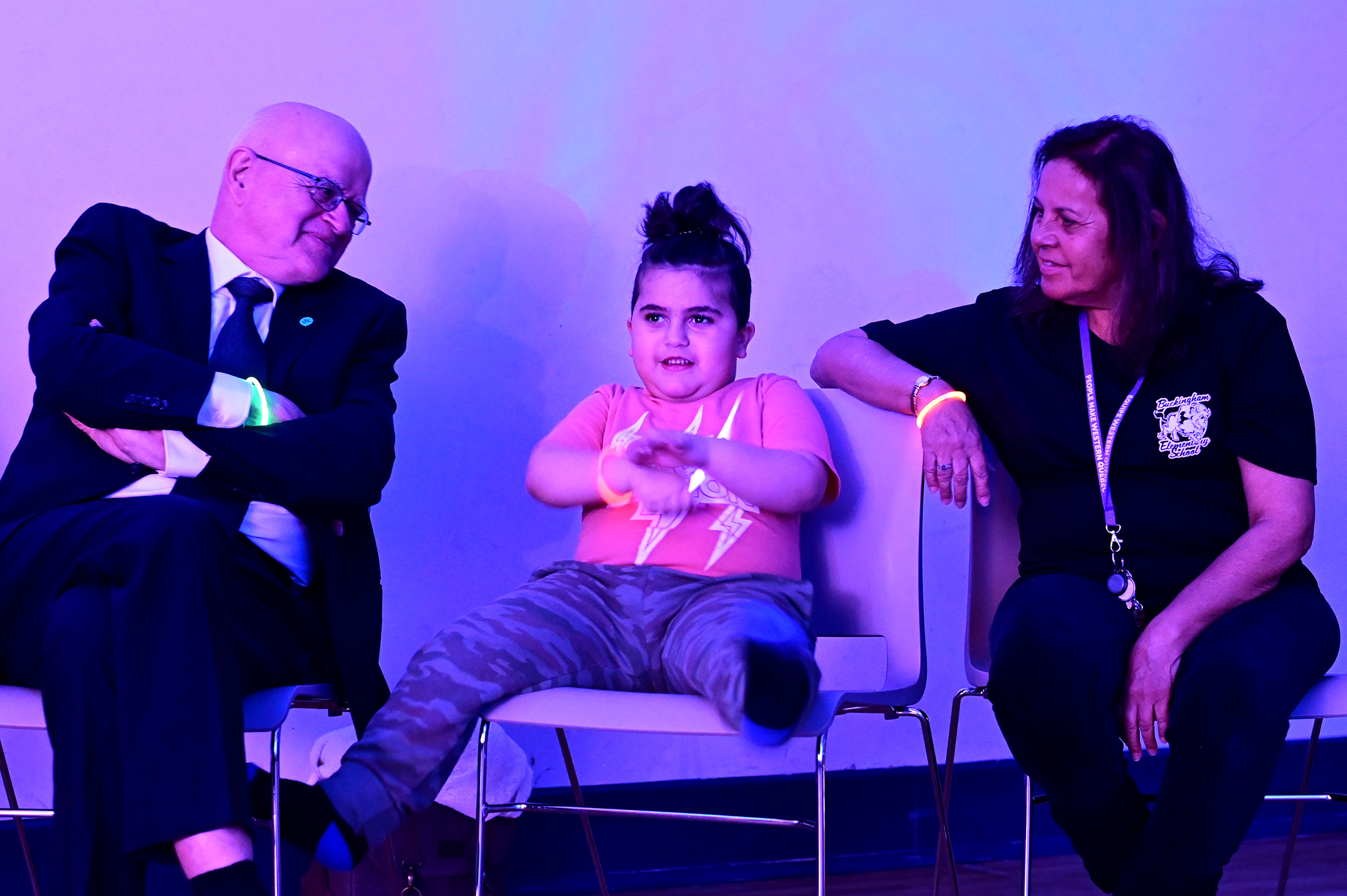 Chairman of the board, Wayne Daly, interacting with a lively student.