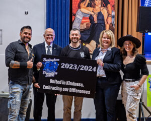 Group photo, L-R: Jaaji of Twin Flames, Chairman Wayne Daly, Principcal James Price, Director of Education Jennifer Dubeau, and Chelsey June of Twin Flames 