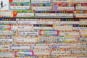 Community mural where each student wrote one quality that makes them unique