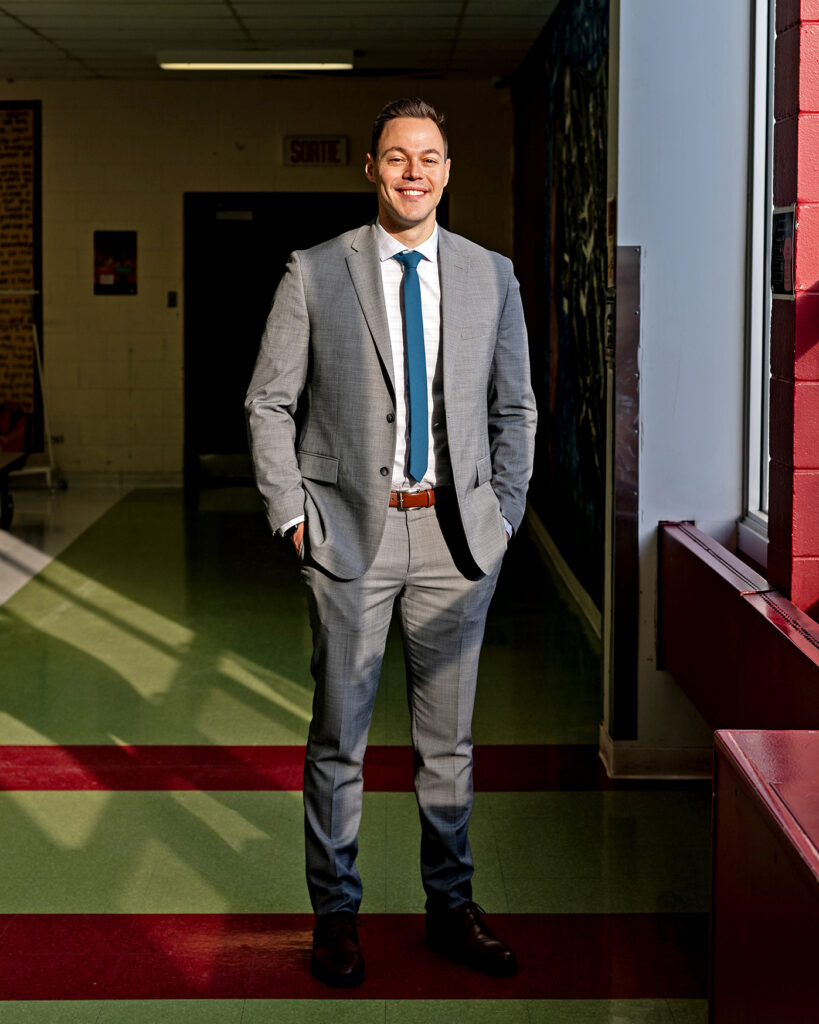DSC_5659 Jeremy standing by a sunny window in the cafeteria