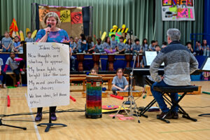 Ms. Medley and Mr. Piper lead the performance