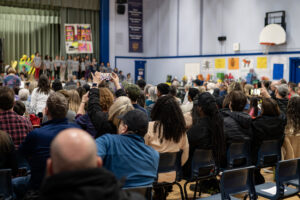 Proud parents recording during the second performance