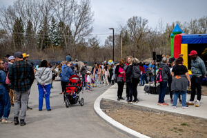 Photo shows the outside, with the live band playing, the bouncy castle and the horse carriage in the background