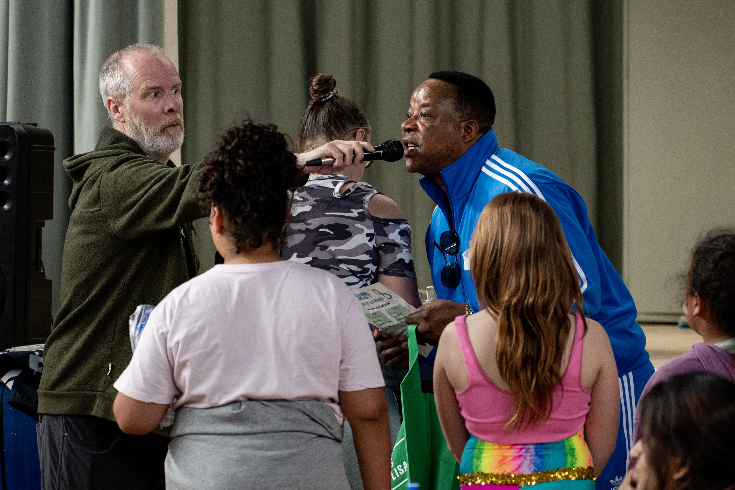 Trait d'Union during the raffle prizes, aided by MC Steve Ball