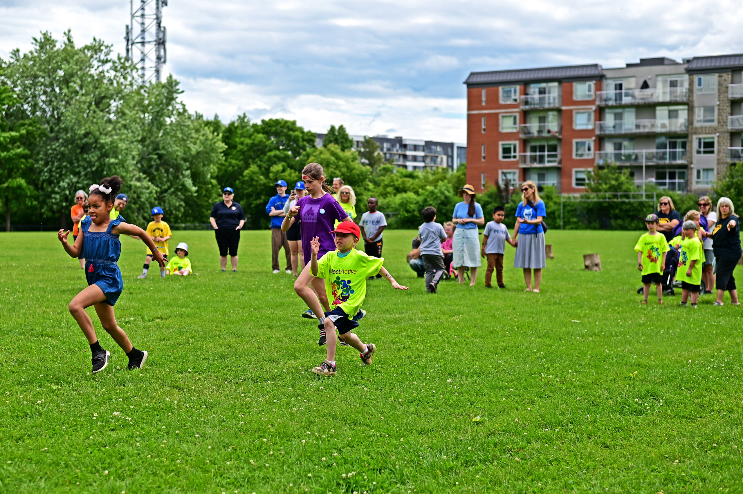 Students runnning on the grass for the final race