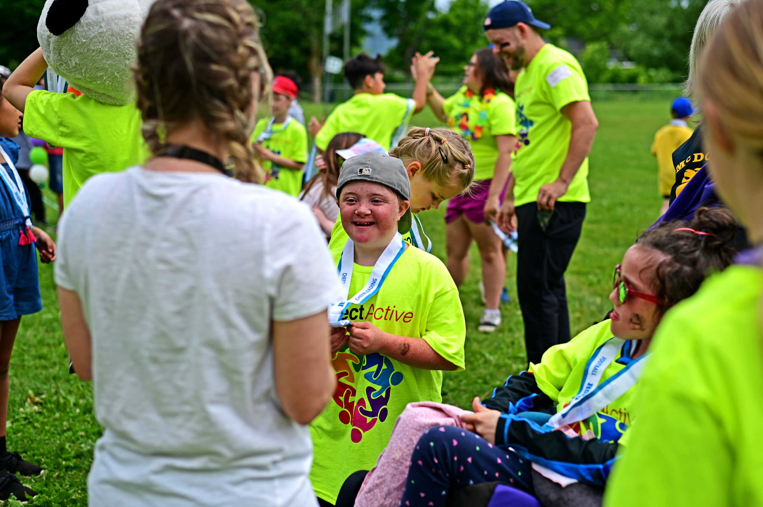 Students chuffed and smiling to receive their medals after a day full of games