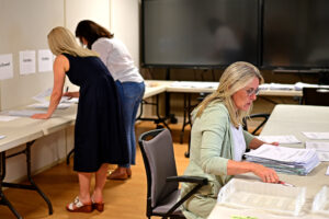 In a seperate area, consultants and administrative technicians work to keep all the exams organized