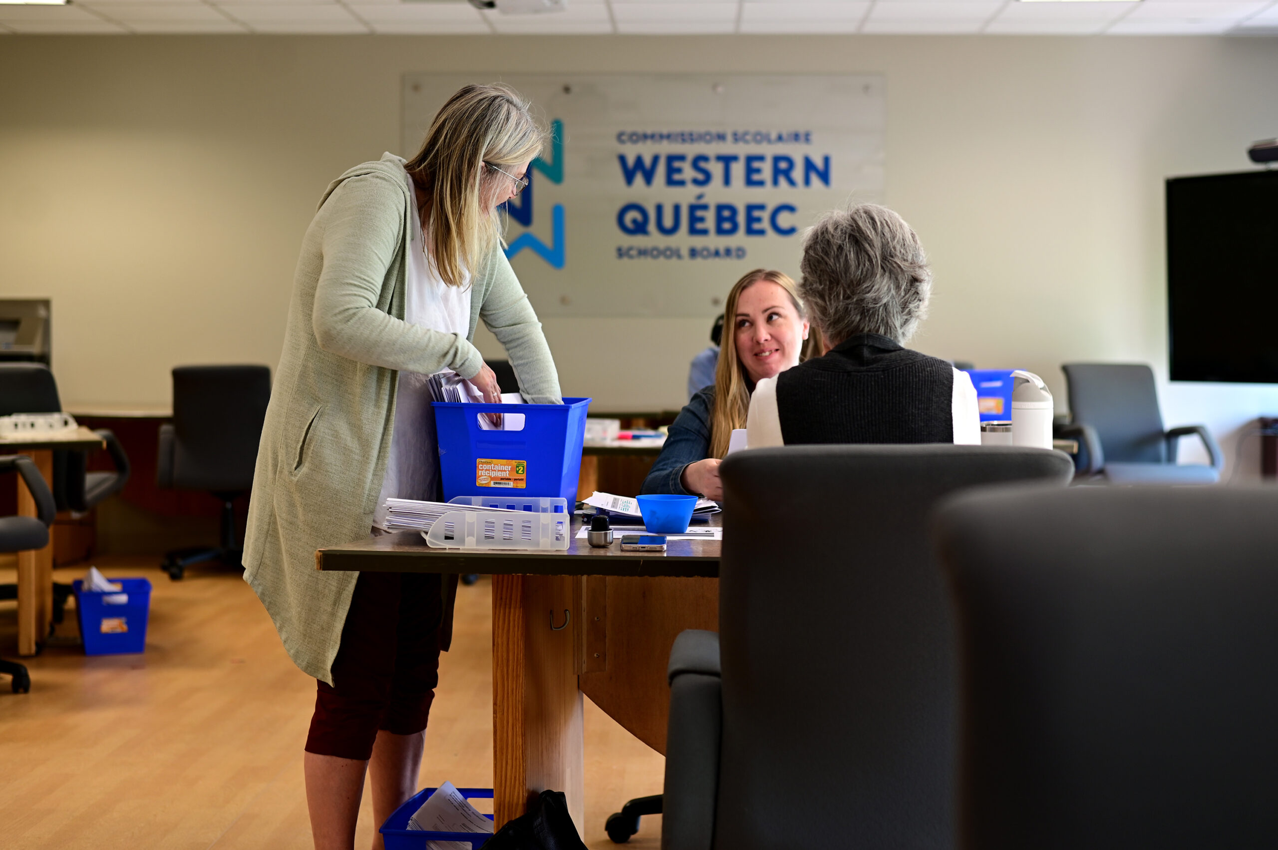 Administrative technician Wendy Wesley at a marking table organizing exams